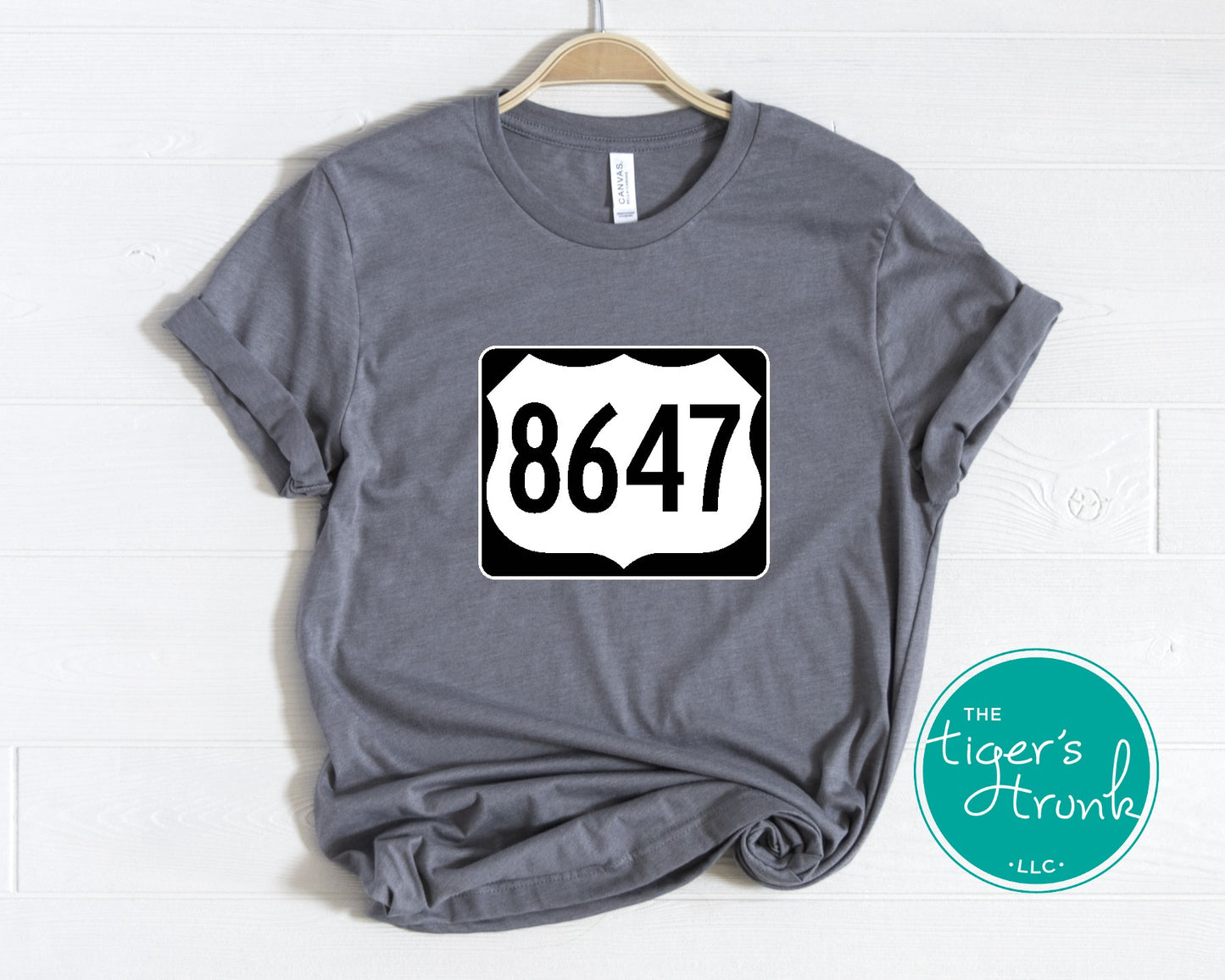 Graphic tee with 8647 inside a highway sign design, subtle political statement shirt for quiet resistance