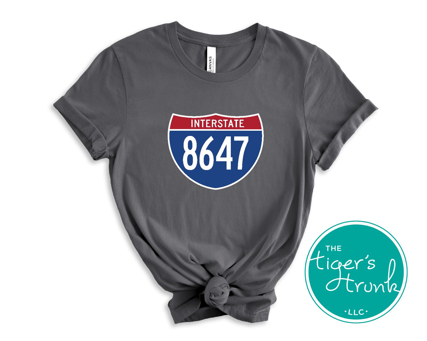 T-shirt featuring 8647 inside an Interstate sign, clean and bold design with a subtle political message