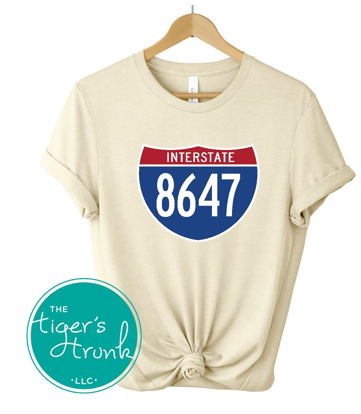 T-shirt featuring 8647 inside an Interstate sign, clean and bold design with a subtle political message
