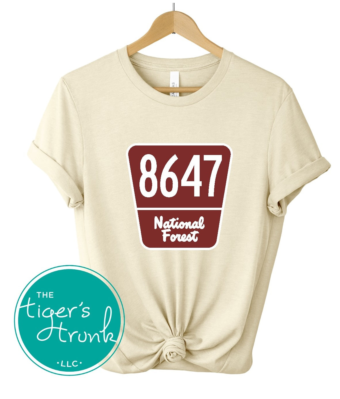 T-shirt with 8647 on a National Forest-style sign, earthy and subtle political protest design for nature lovers