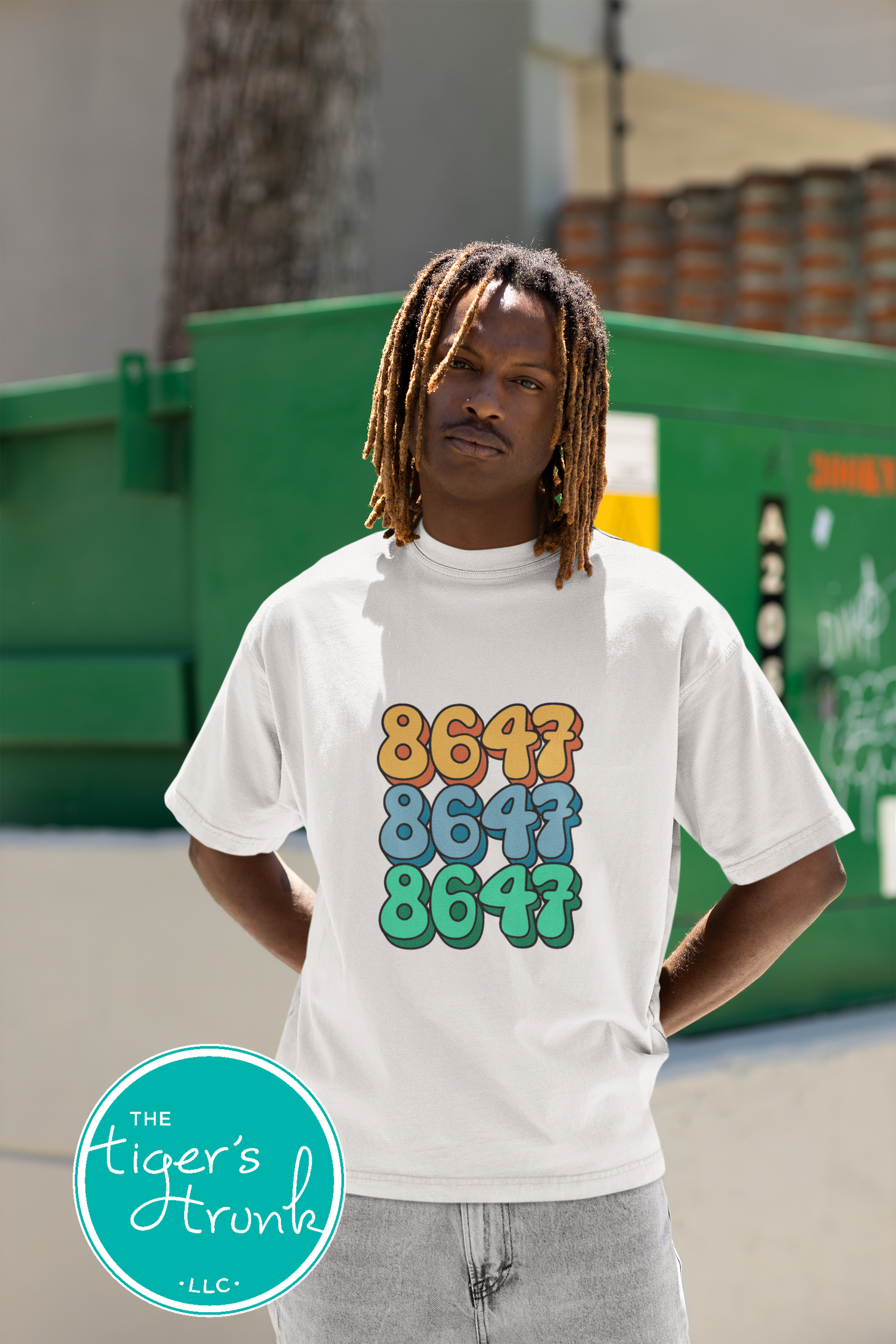 Close-up of a shirt featuring the number 8647, a subtle nod to resistance and activism.