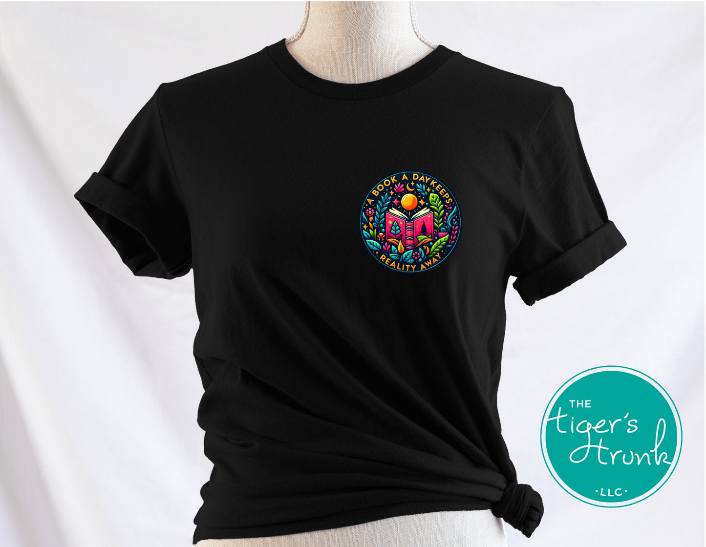 T-shirt with the phrase "A Book a Day Keeps Reality Away," perfect for readers, book lovers, and introverts
