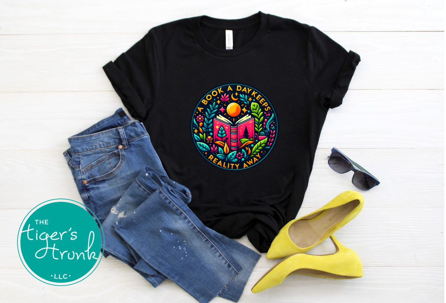 T-shirt with the phrase "A Book a Day Keeps Reality Away," perfect for readers, book lovers, and introverts