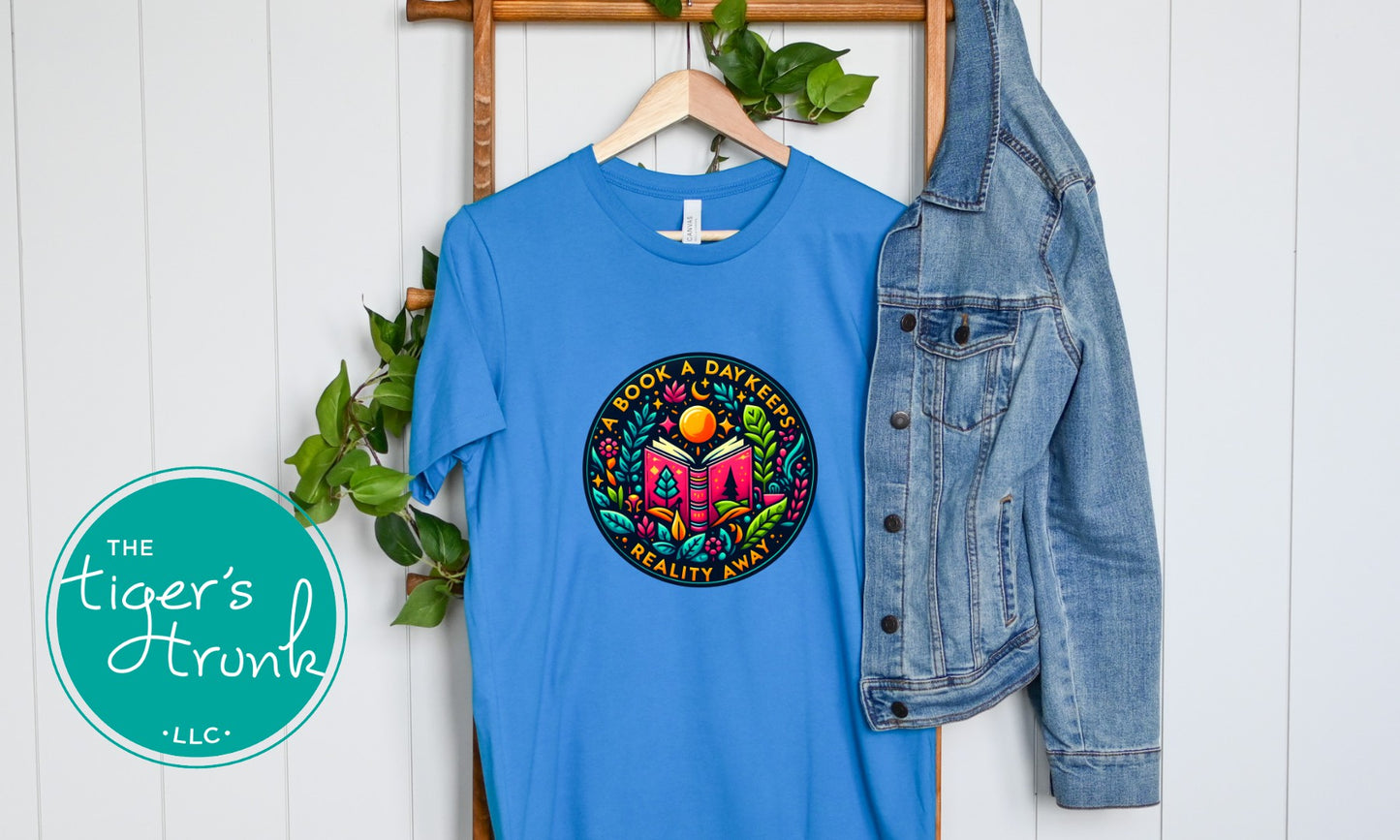 T-shirt with the phrase "A Book a Day Keeps Reality Away," perfect for readers, book lovers, and introverts