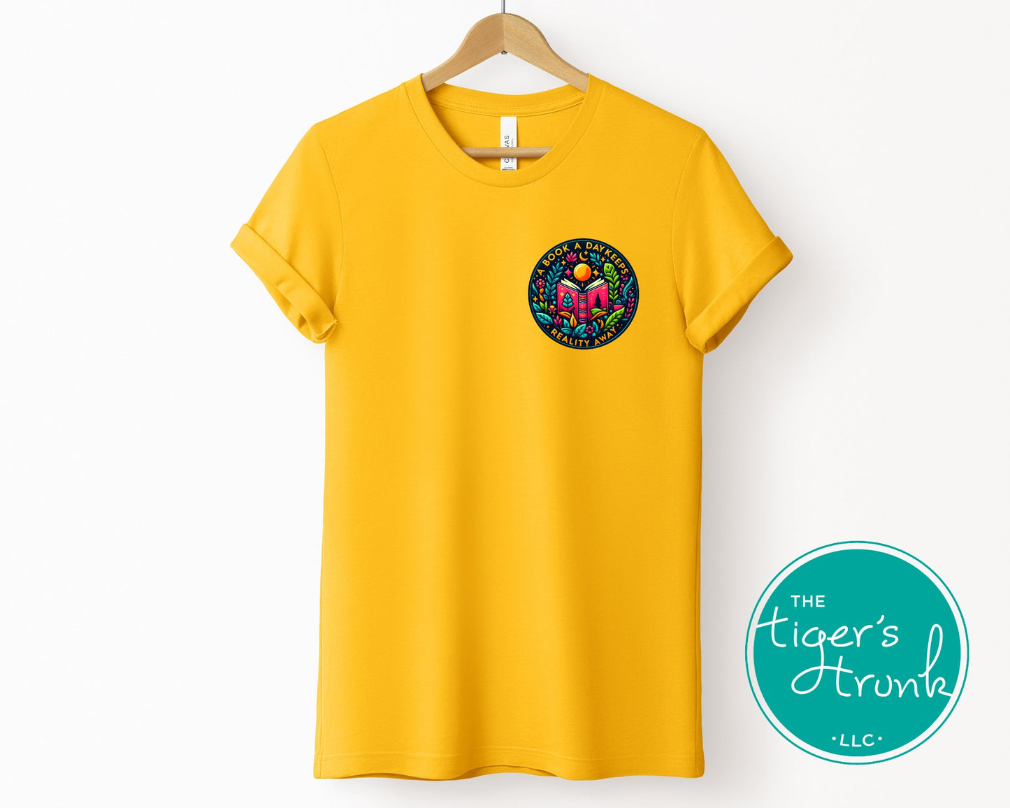 T-shirt with the phrase "A Book a Day Keeps Reality Away," perfect for readers, book lovers, and introverts