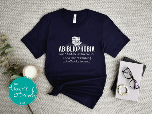 Abibliophobia graphic t-shirt displayed flat, funny literary tee for readers and book lovers, ideal gift for bibliophiles
