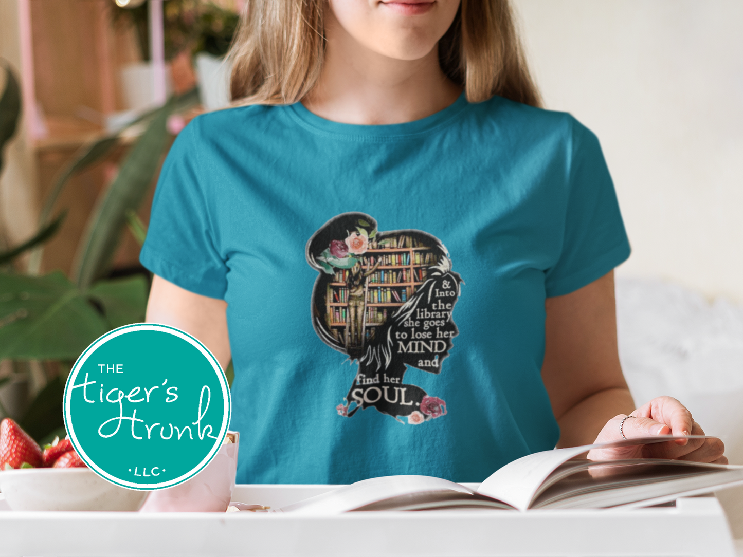 T-shirt with the quote "And to the Library She Goes to Lose Her Mind and Find Her Soul," perfect for readers and book lovers
