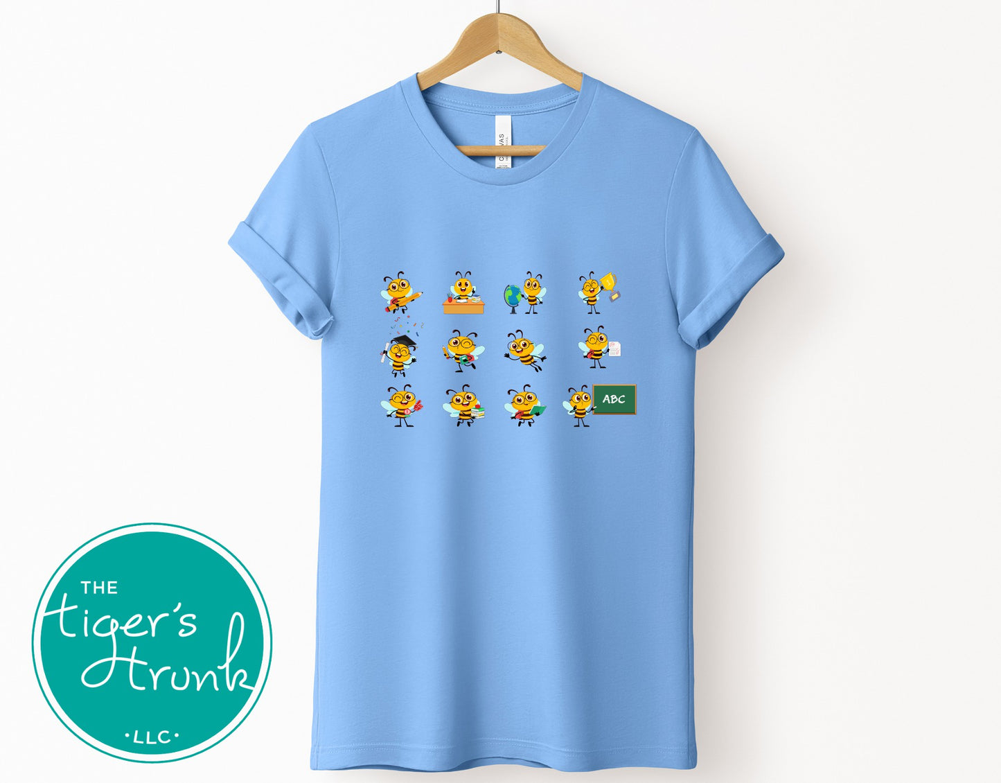 Graphic t-shirt with cartoon bees doing teacher tasks, playful and fun design perfect for school staff and educators