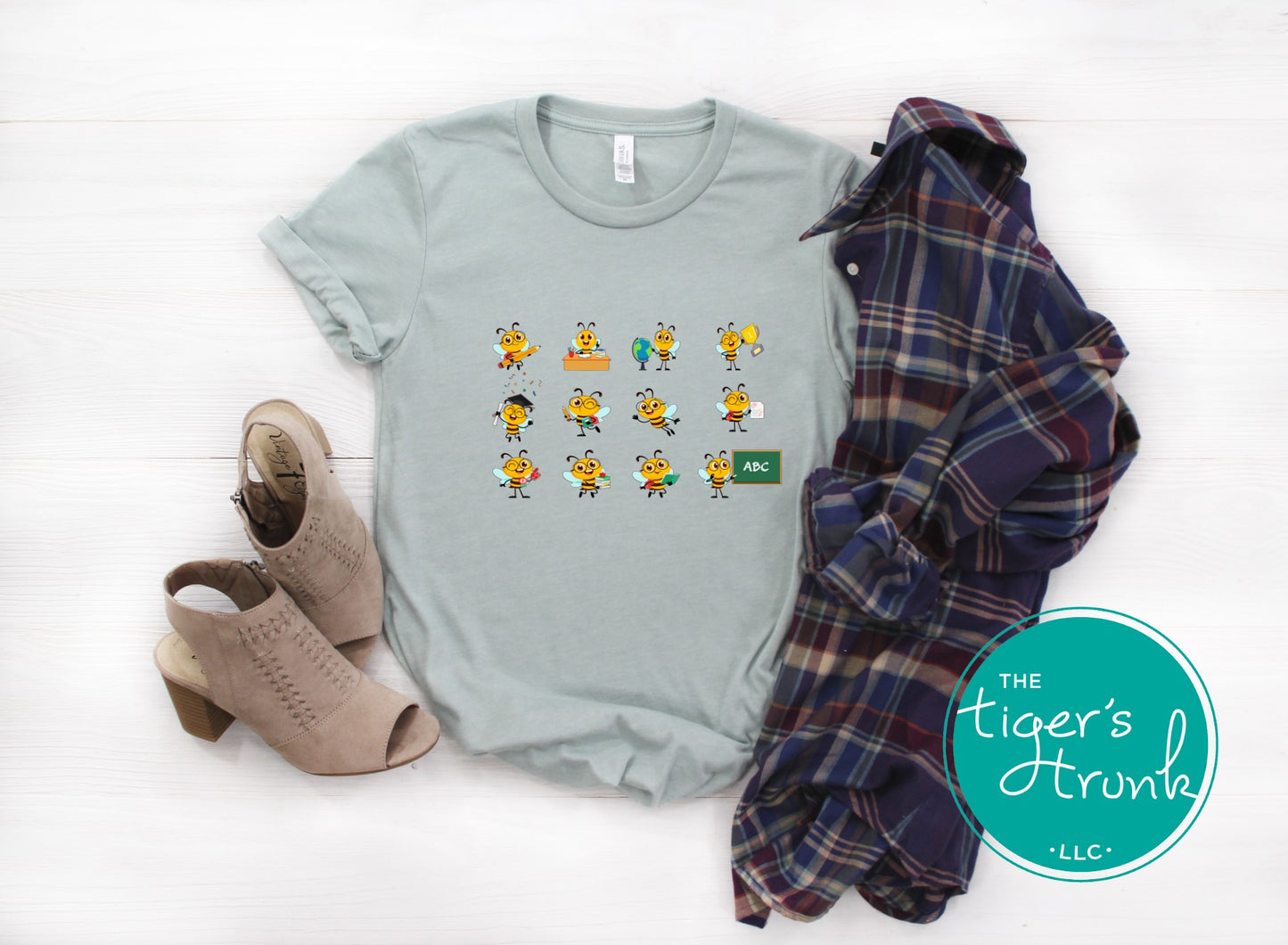 Graphic t-shirt with cartoon bees doing teacher tasks, playful and fun design perfect for school staff and educators