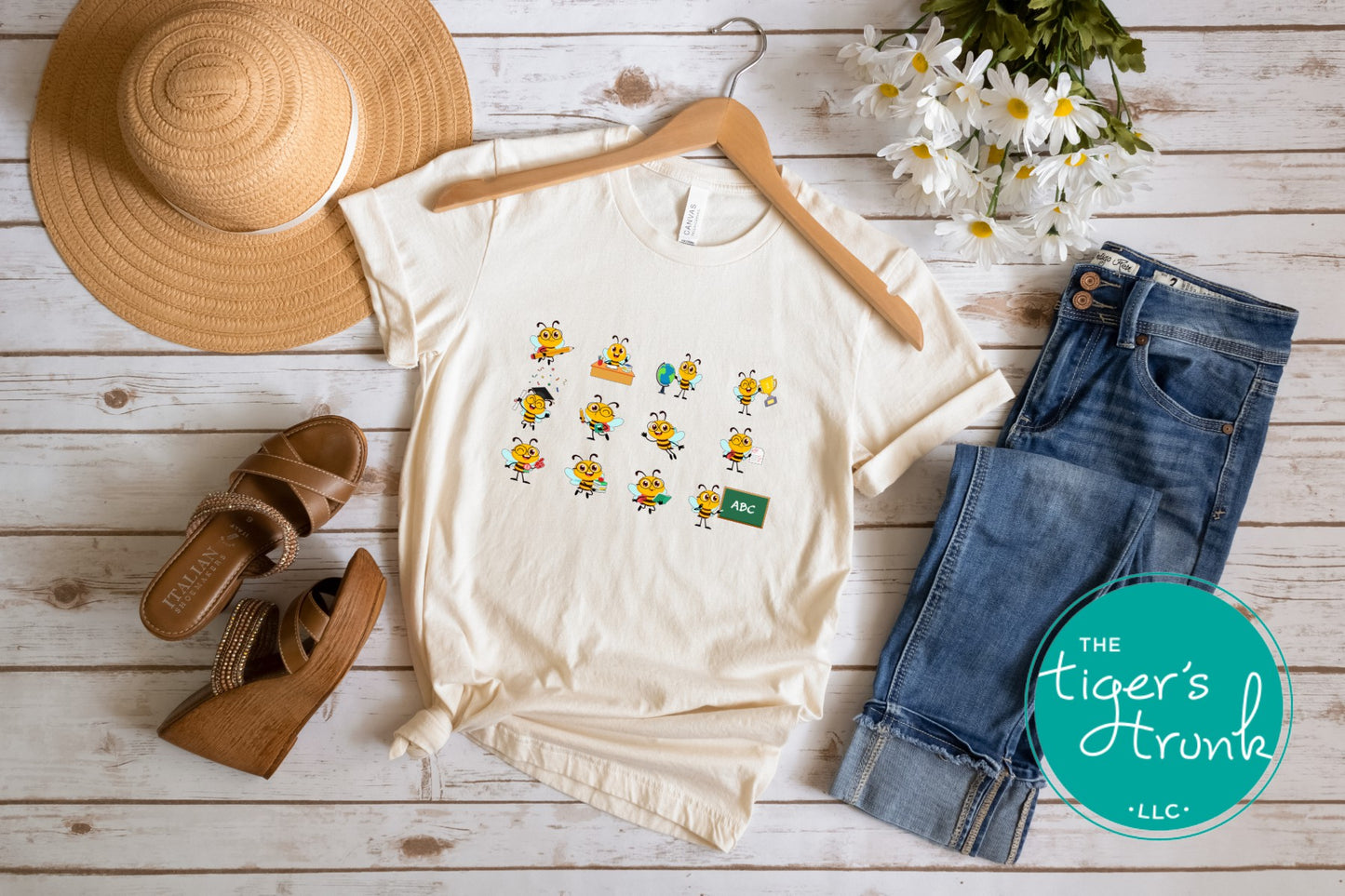 Graphic t-shirt with cartoon bees doing teacher tasks, playful and fun design perfect for school staff and educators