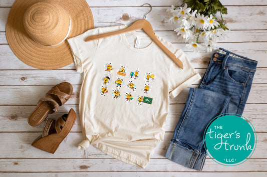 Graphic t-shirt with cartoon bees doing teacher tasks, playful and fun design perfect for school staff and educators