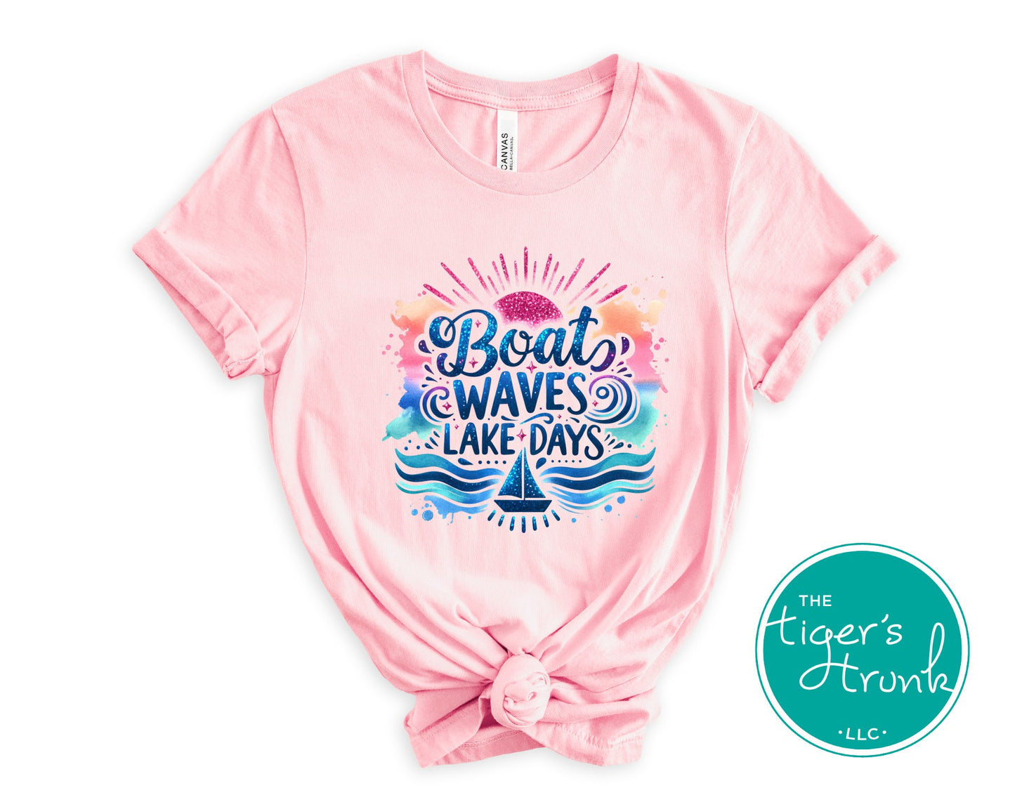 Pink t-shirt with colorful graphic and text on a white background, featuring 'The Tiger's Den' logo.