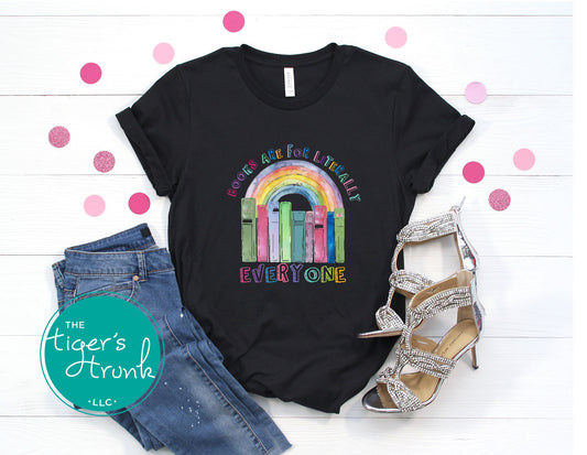 T-shirt with pastel rainbow and books graphic, reading tee with the phrase "Books Are for Literally Everyone," inclusive shirt for readers and allies