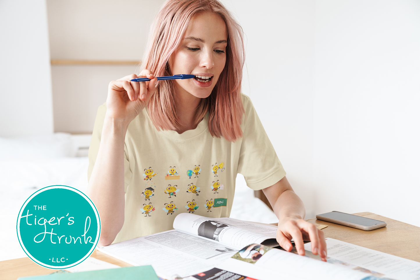 Graphic t-shirt with cartoon bees doing teacher tasks, playful and fun design perfect for school staff and educators