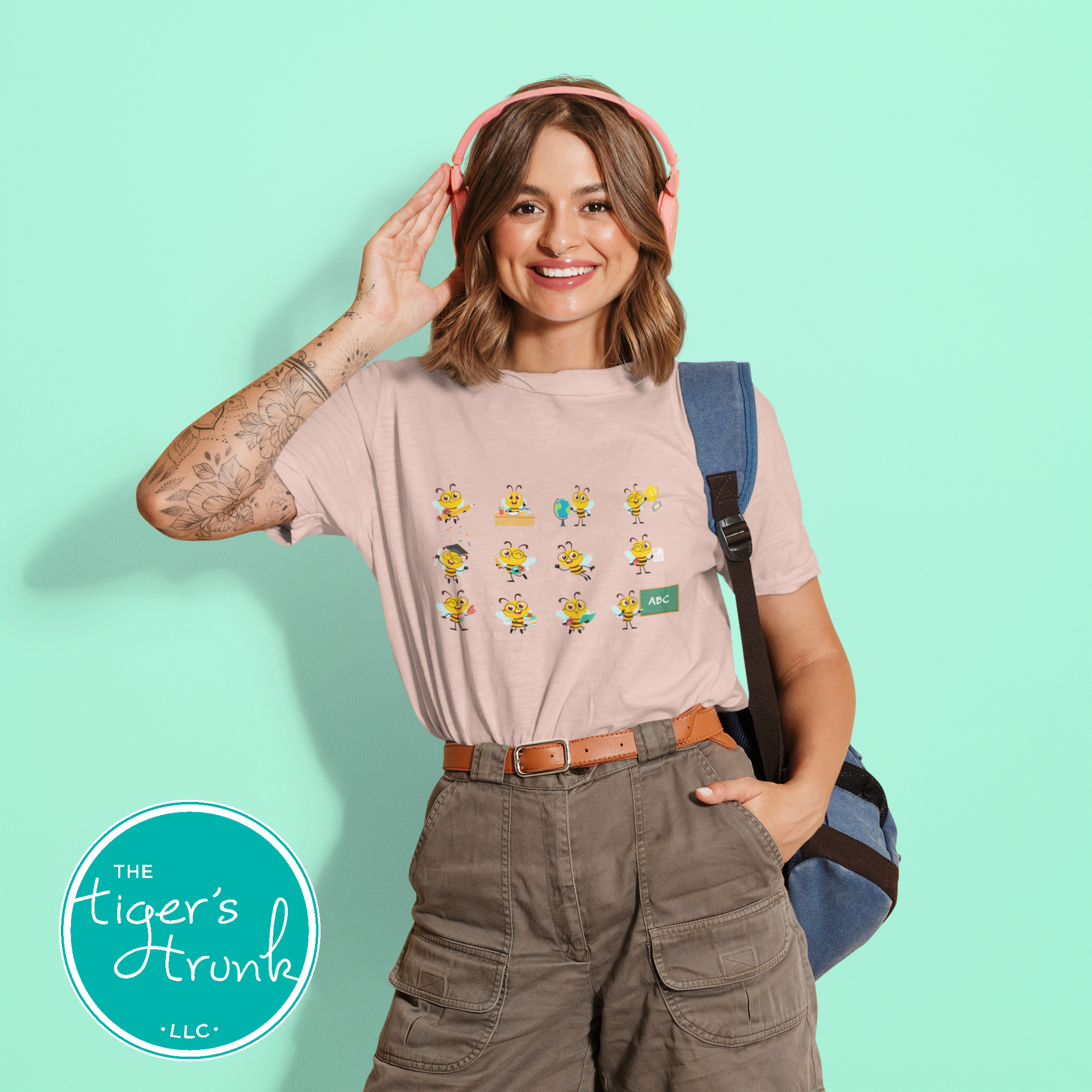 Graphic t-shirt with cartoon bees doing teacher tasks, playful and fun design perfect for school staff and educators