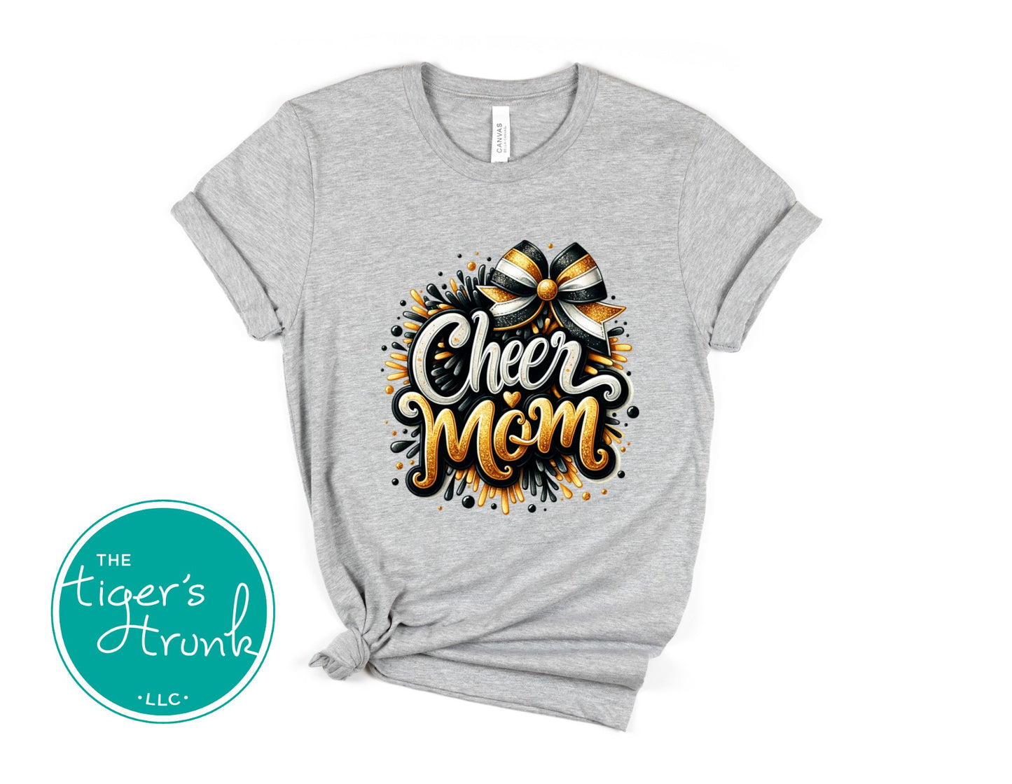 Athletic heather t-shirt with 'Cheer Mom' design and bow graphic, branded with 'The Tiger's Trunk'.