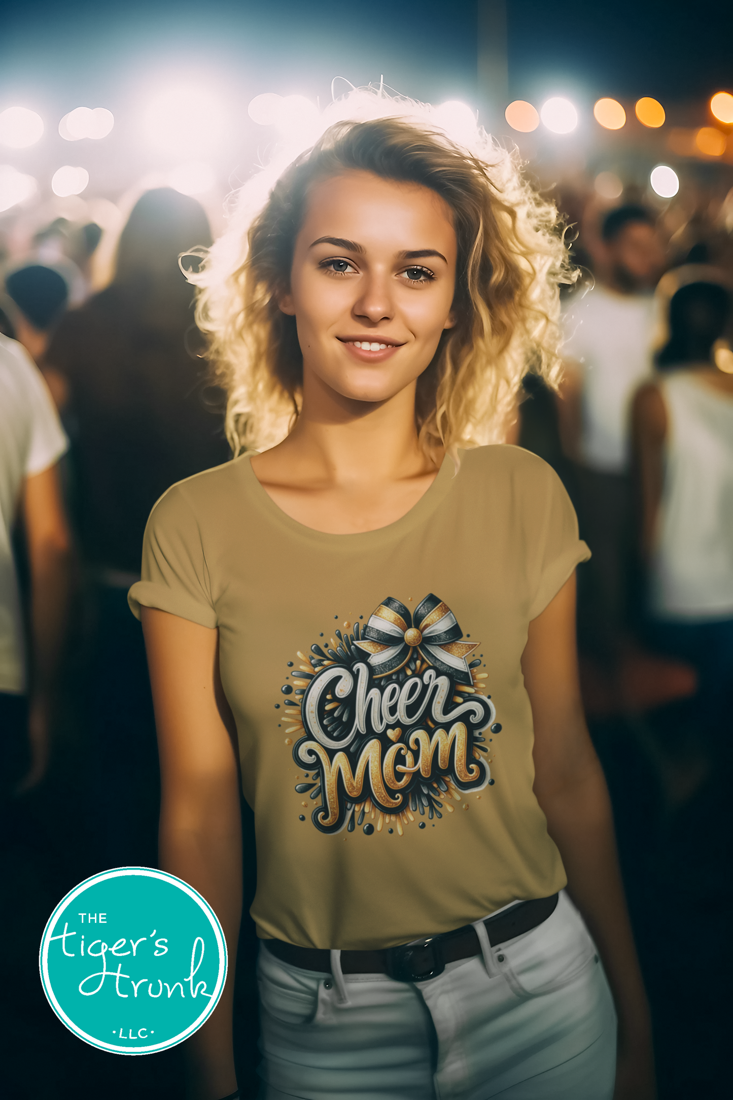 Woman wearing a 'Cheer Mom' t-shirt in a crowd at night.