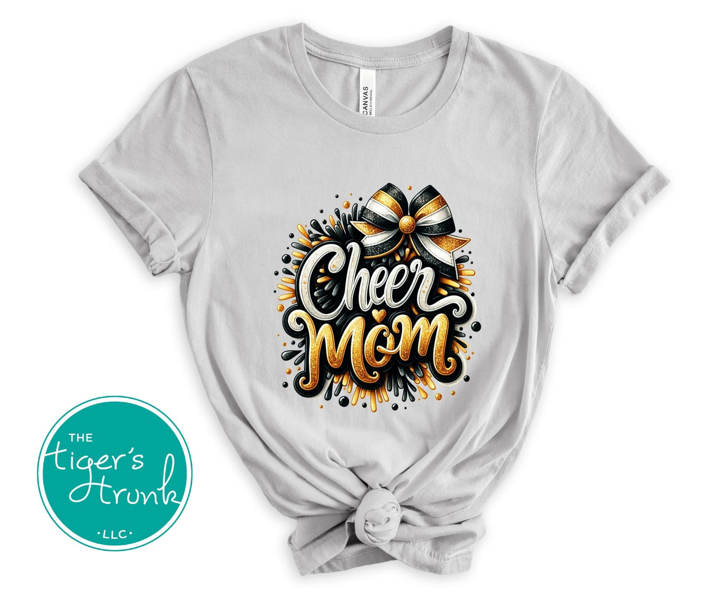 Gray t-shirt with 'Cheer Mom' design and bow graphic, branded with 'The Tiger's Horn'.