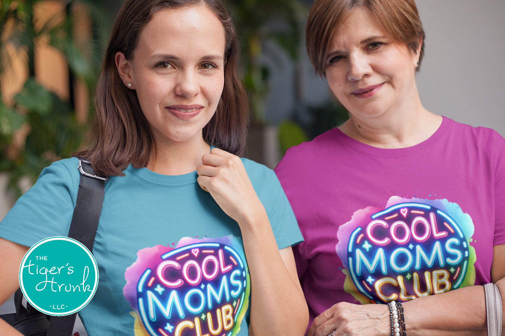 Graphic t-shirt with Cool Mom's Club text in neon colors, fun and trendy design for stylish moms