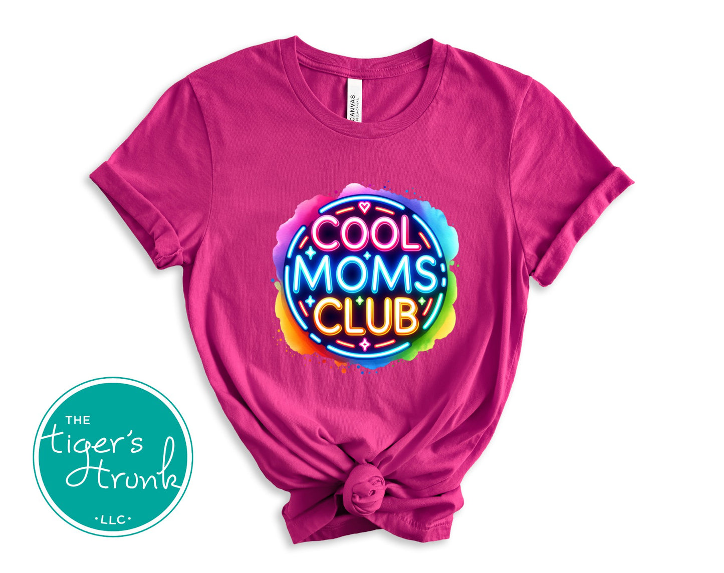 Graphic t-shirt with Cool Mom's Club text in neon colors, fun and trendy design for stylish moms