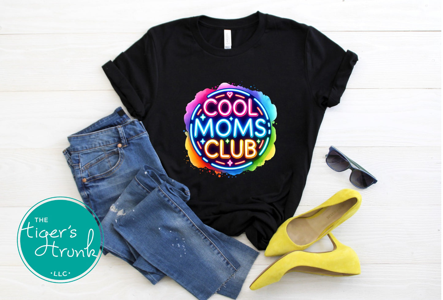 Graphic t-shirt with Cool Mom's Club text in neon colors, fun and trendy design for stylish moms