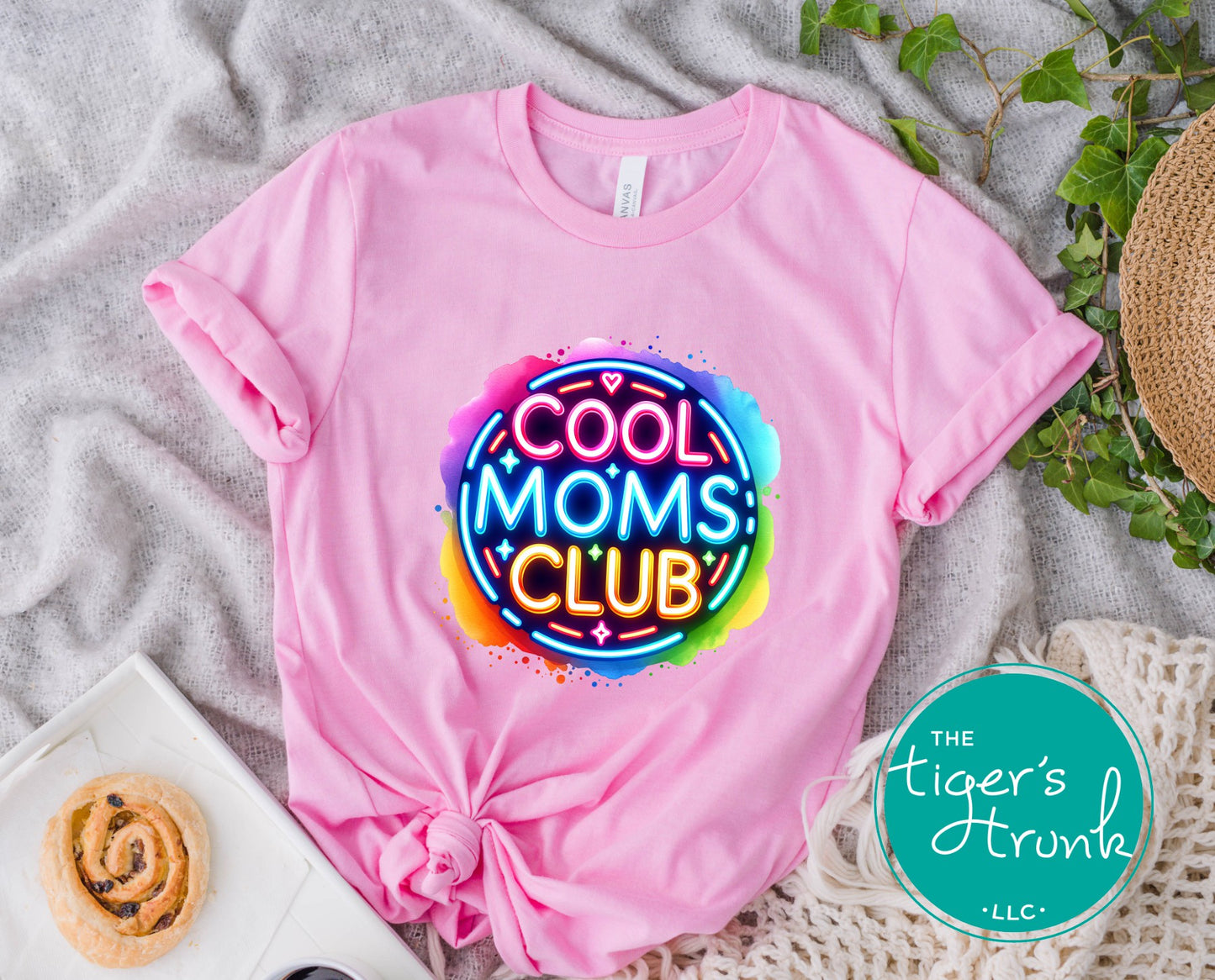 Graphic t-shirt with Cool Mom's Club text in neon colors, fun and trendy design for stylish moms