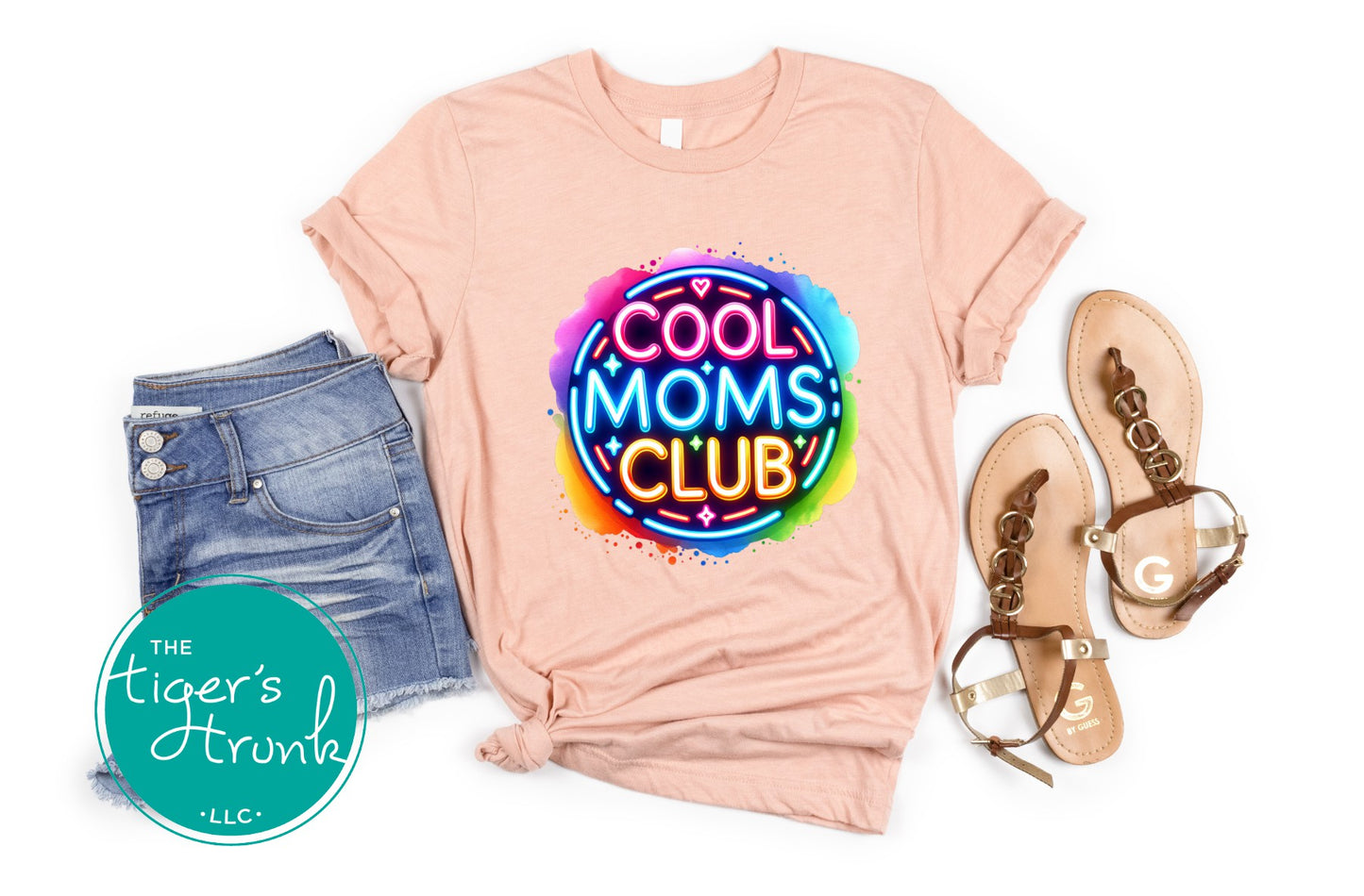 Graphic t-shirt with Cool Mom's Club text in neon colors, fun and trendy design for stylish moms