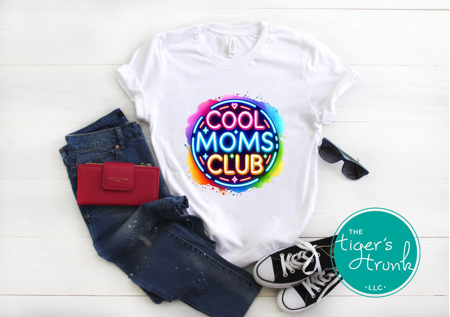 Graphic t-shirt with Cool Mom's Club text in neon colors, fun and trendy design for stylish moms