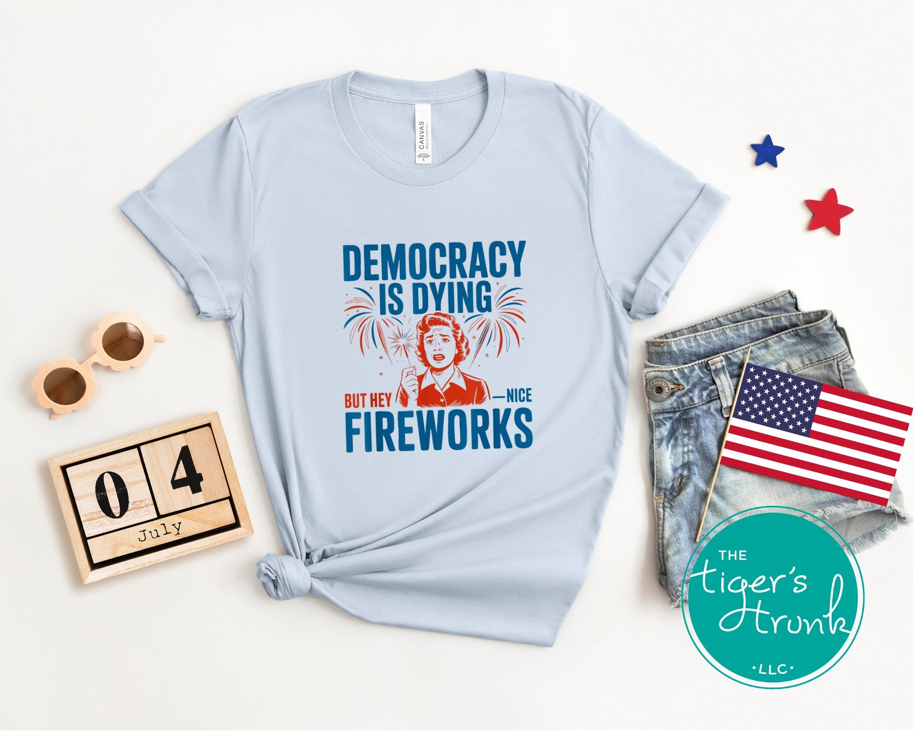 Bold political t-shirt reading Democracy Is Dying But Hey, Nice Fireworks, designed for Fourth of July truth-telling and protest