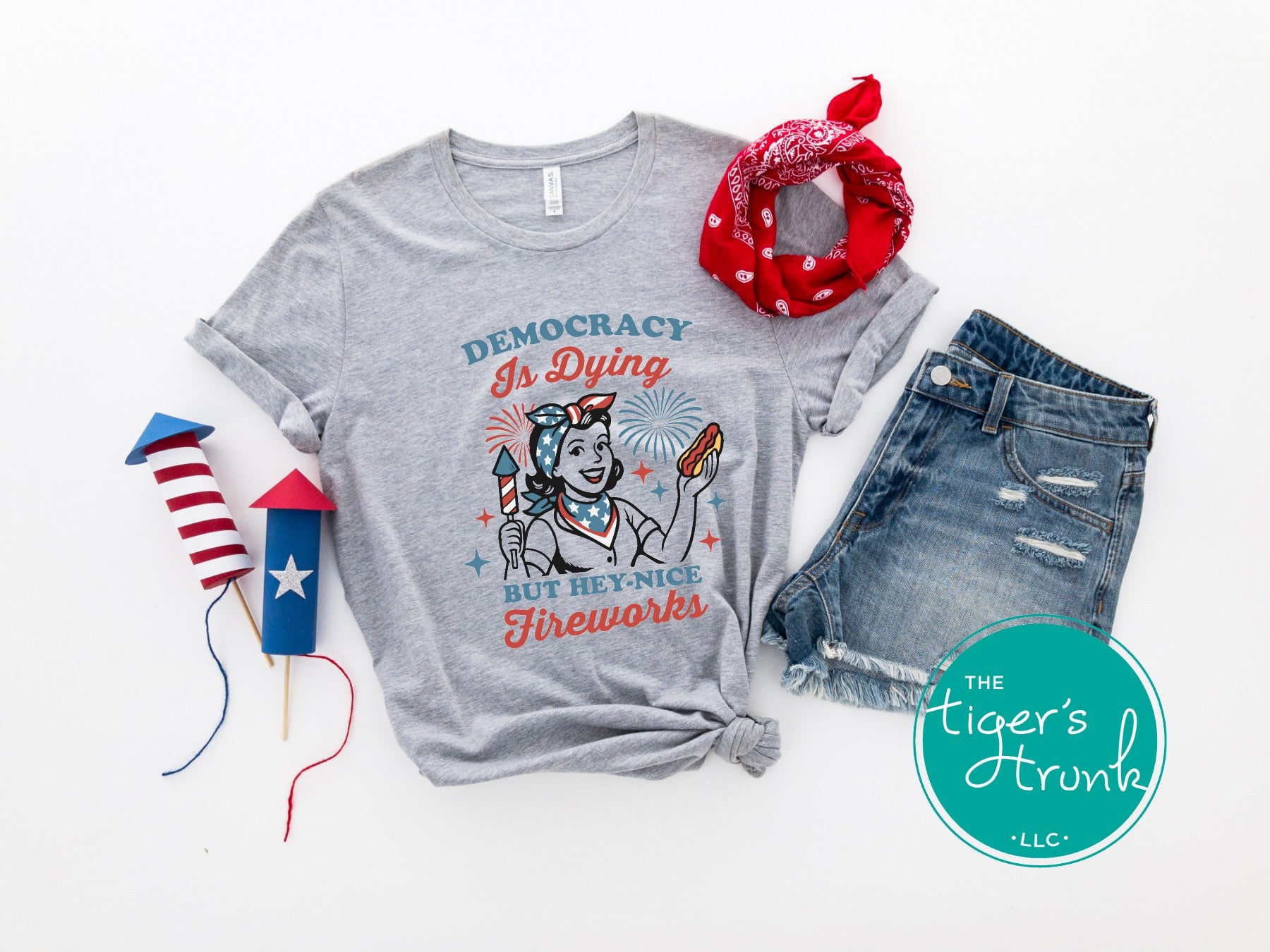 Patriotic graphic t-shirt that reads Democracy Is Dying But Hey, Nice Fireworks, political and sarcastic July Fourth shirt