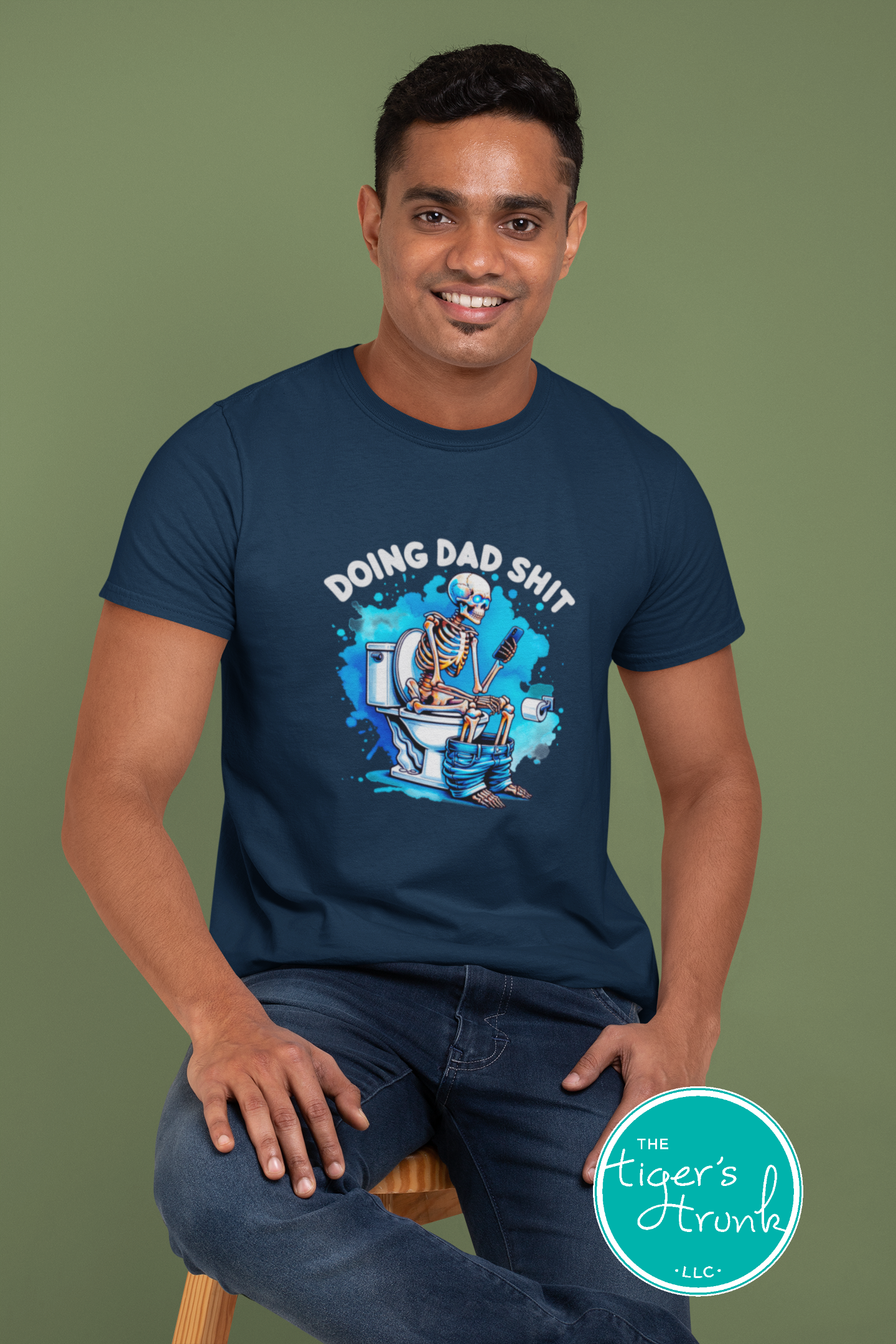Skeleton sitting on a toilet with the phrase "Doing Dad Shit," printed on a t-shirt for dad humor and Father’s Day gifts