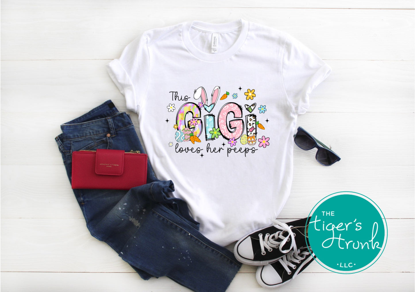 Easter t-shirt with "Gigi" in pastel spring print font including bunnies, florals, and Easter eggs, perfect for spring celebrations