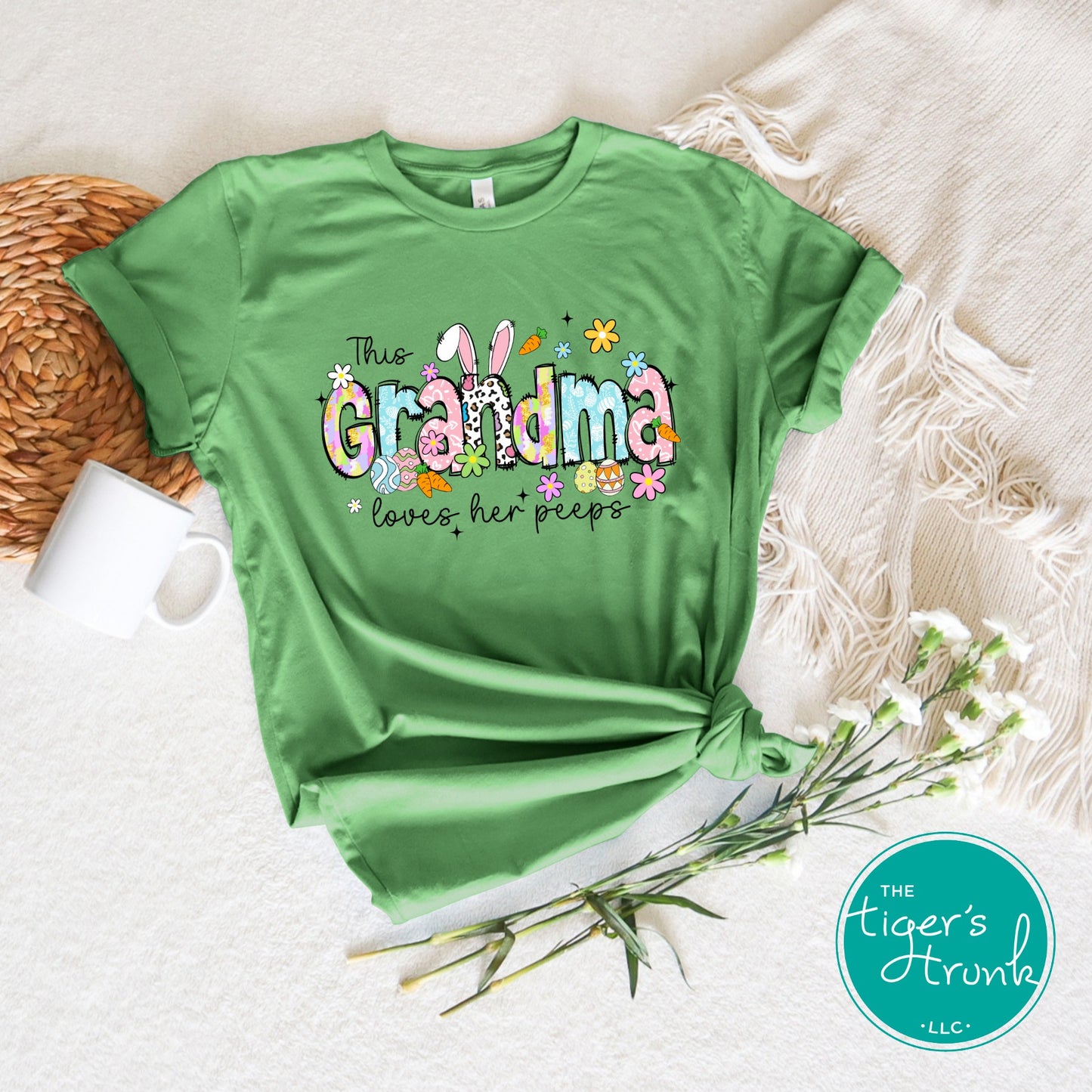 Easter t-shirt with "Grandma" in pastel spring print font featuring bunnies, florals, and eggs, perfect for Easter brunch and family gatherings