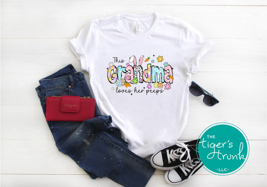 Easter t-shirt with "Grandma" in pastel spring print font featuring bunnies, florals, and eggs, perfect for Easter brunch and family gatherings