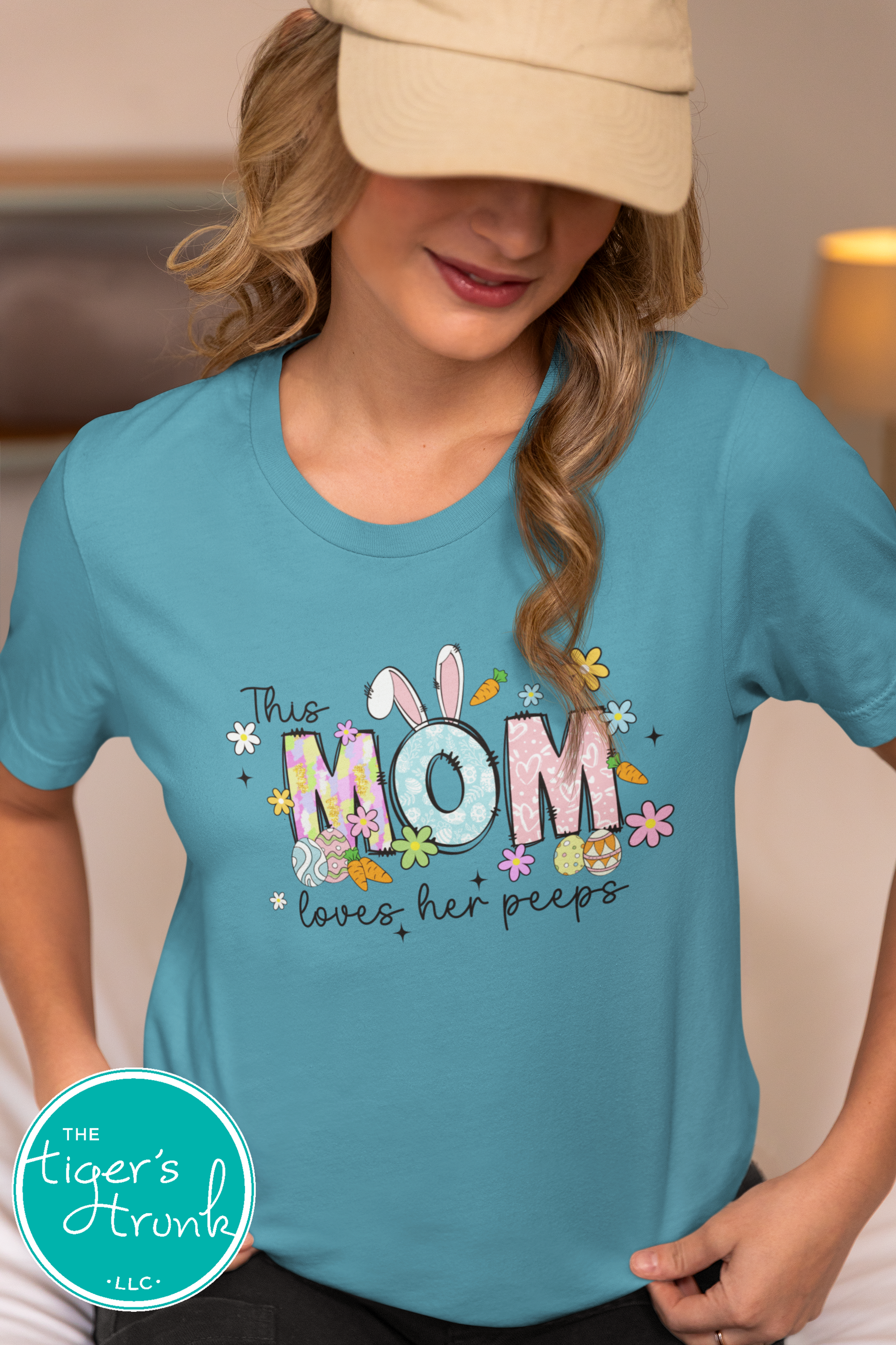 Easter t-shirt for Mom with spring-themed pastel font, featuring bunnies, flowers, and Easter prints in the word Mom