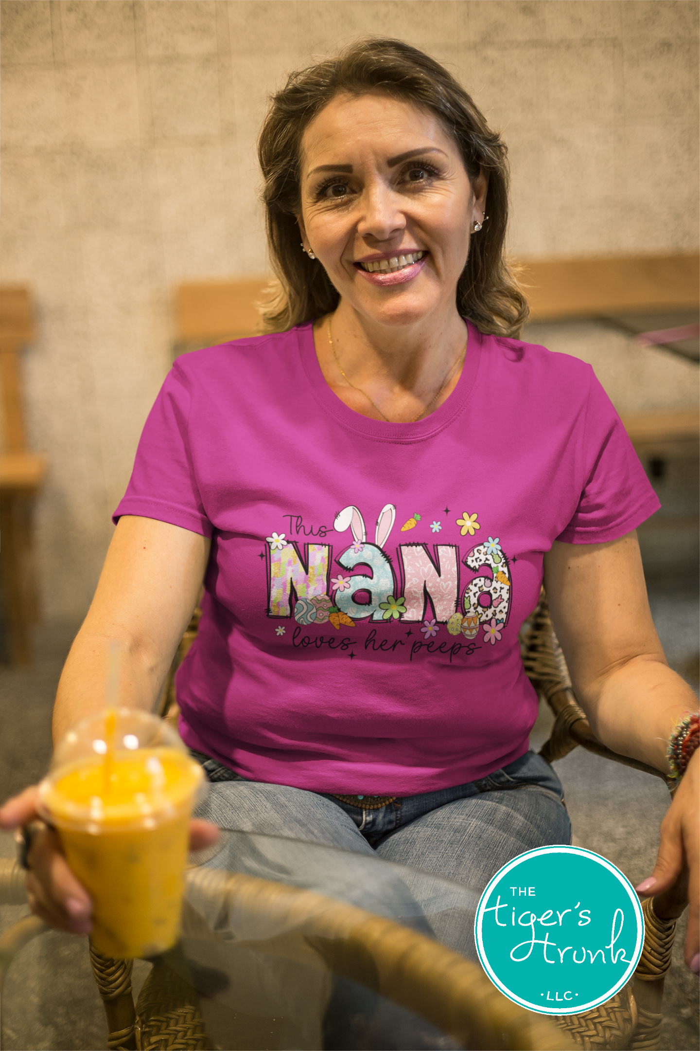 Easter t-shirt with "Nana" in pastel spring print font with bunnies, eggs, and flowers, perfect for holiday gatherings and egg hunts