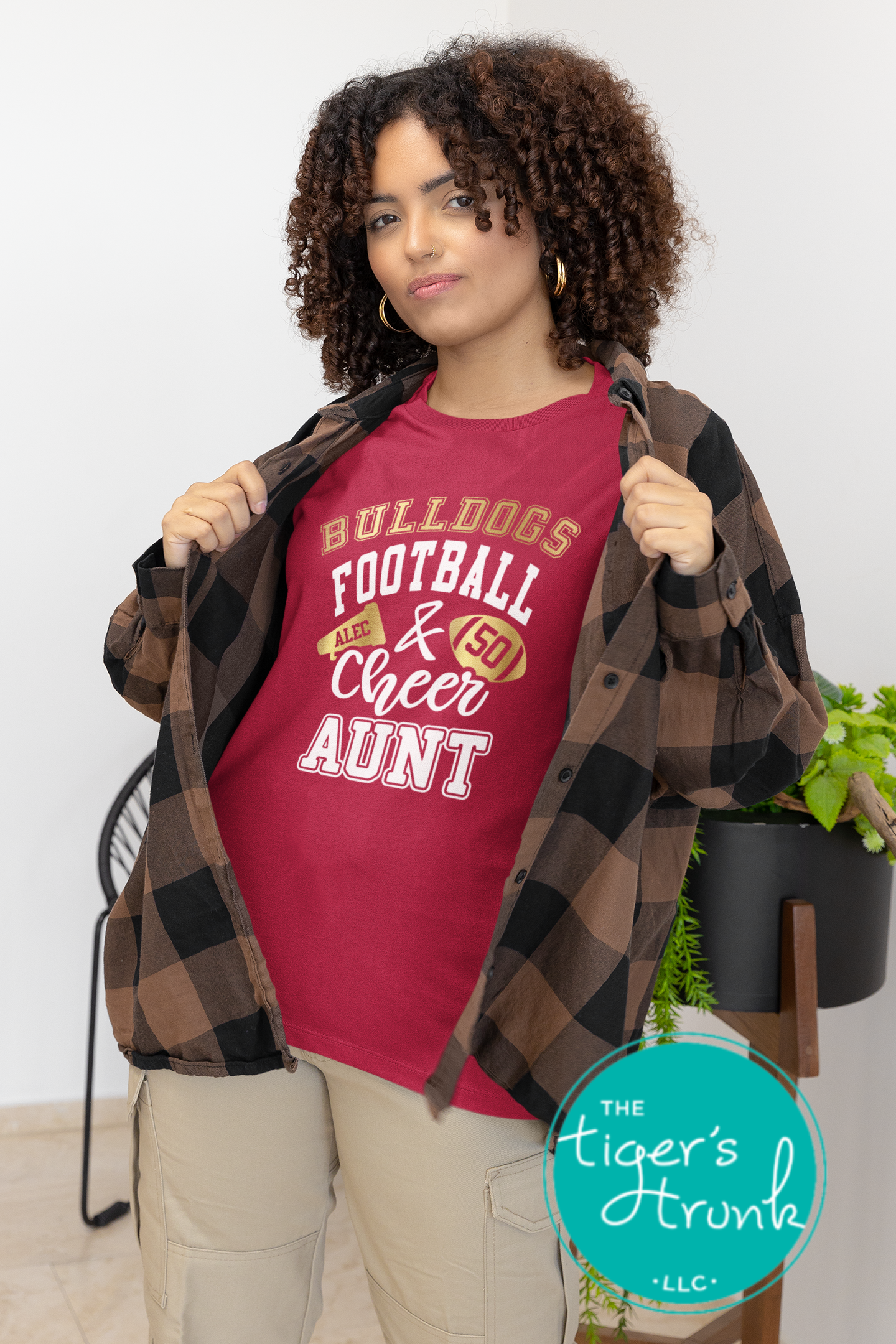Custom Football and Cheer Aunt t-shirt with school colors, mascot name, megaphone and football design, featuring cheerleader and player personalization
