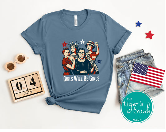 T-shirt with "Girls Will Be Girls" and images of historic women in red, white, and blue, patriotic feminist design for Fourth of July or year-round wear
