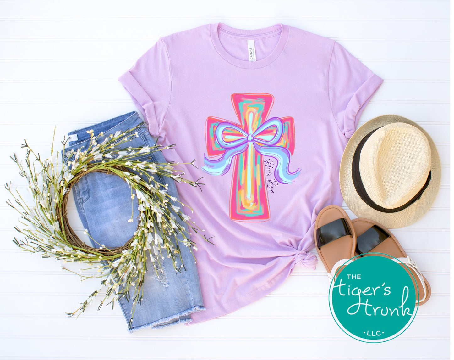 Christian Easter t-shirt with watercolor cross and He Is Risen message, designed for faith-based spring celebrations