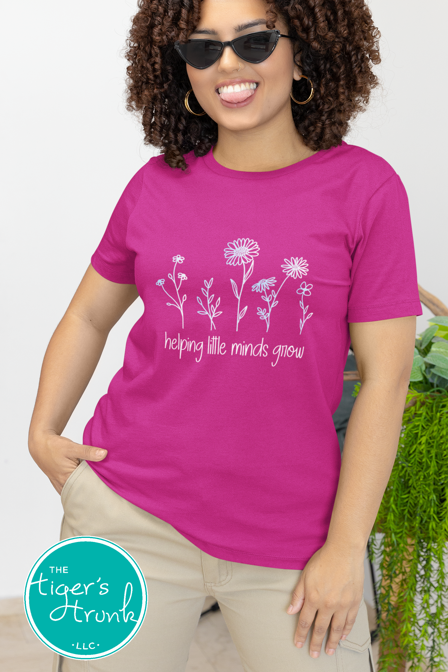 T-shirt with wildflowers and the phrase "Helping Little Minds Grow," a soft and inspiring design for educators and school staff