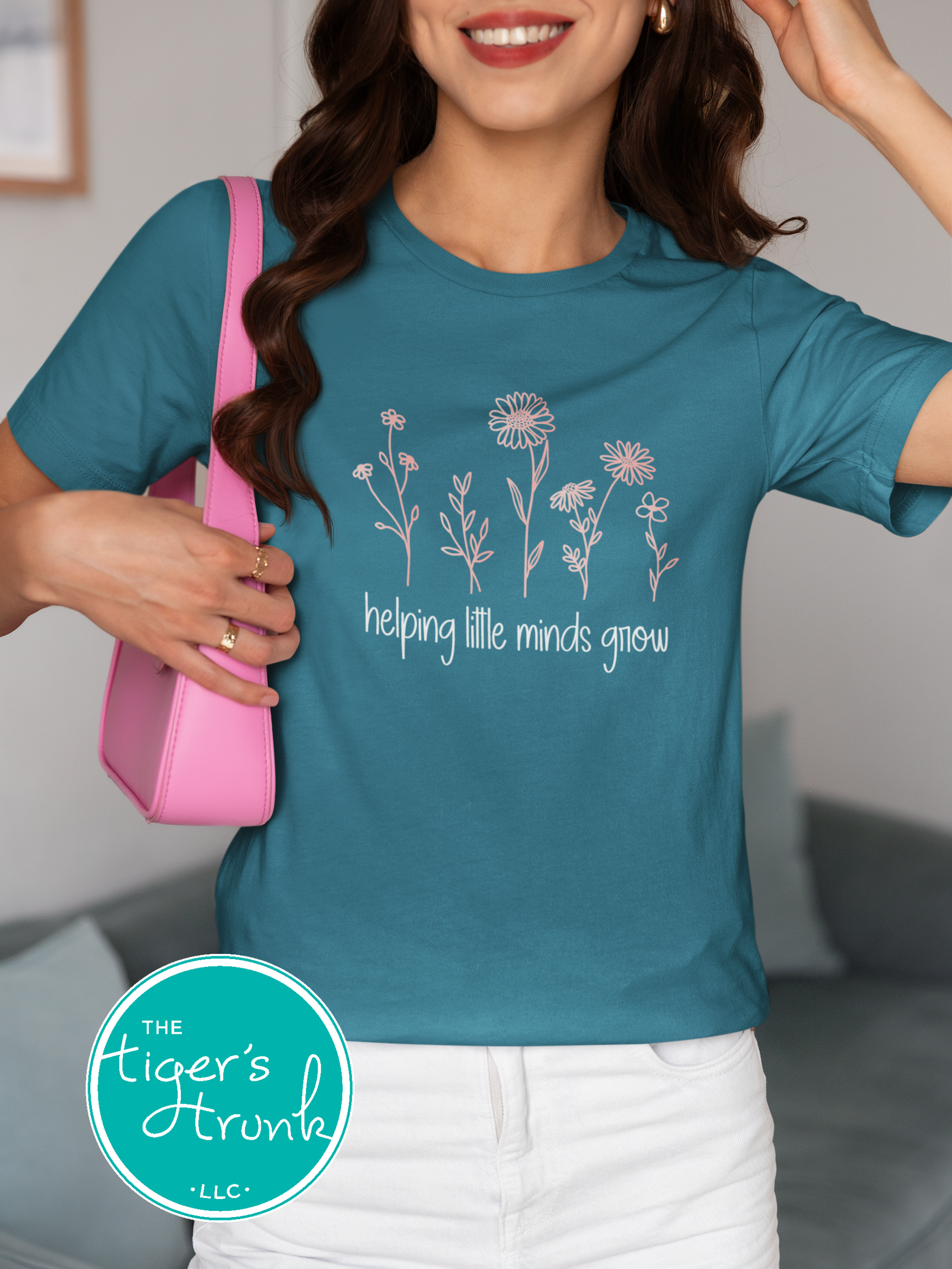 T-shirt with wildflowers and the phrase "Helping Little Minds Grow," a soft and inspiring design for educators and school staff
