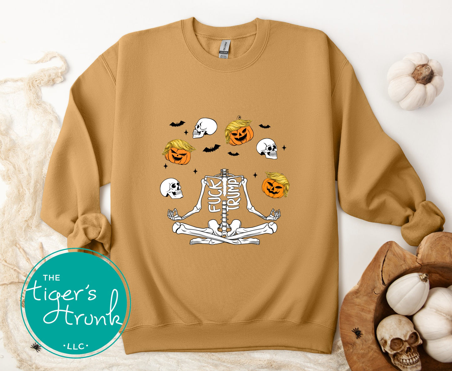 Old Gold sweatshirt with Halloween-themed design on a white background, featuring pumpkins and skeletons.