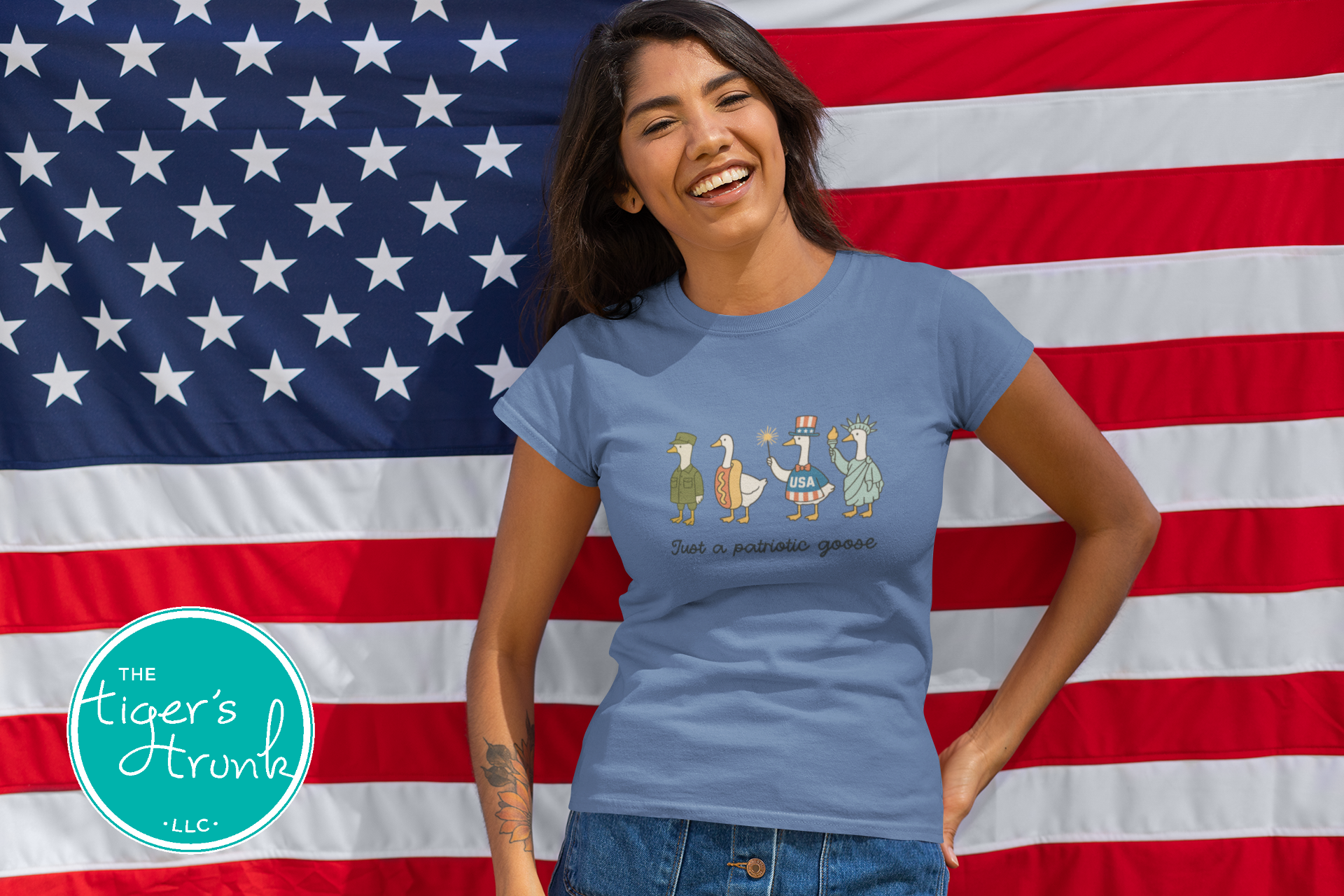 Funny patriotic t-shirt with four geese dressed as a soldier, hotdog, statue, and red-white-blue icon, reading Just a Patriotic Goose