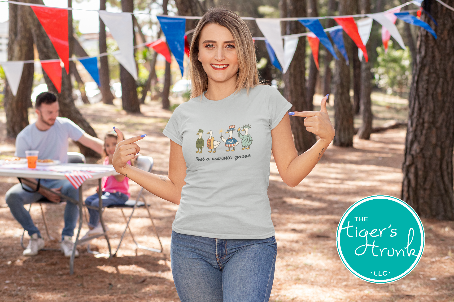 Funny patriotic t-shirt with four geese dressed as a soldier, hotdog, statue, and red-white-blue icon, reading Just a Patriotic Goose