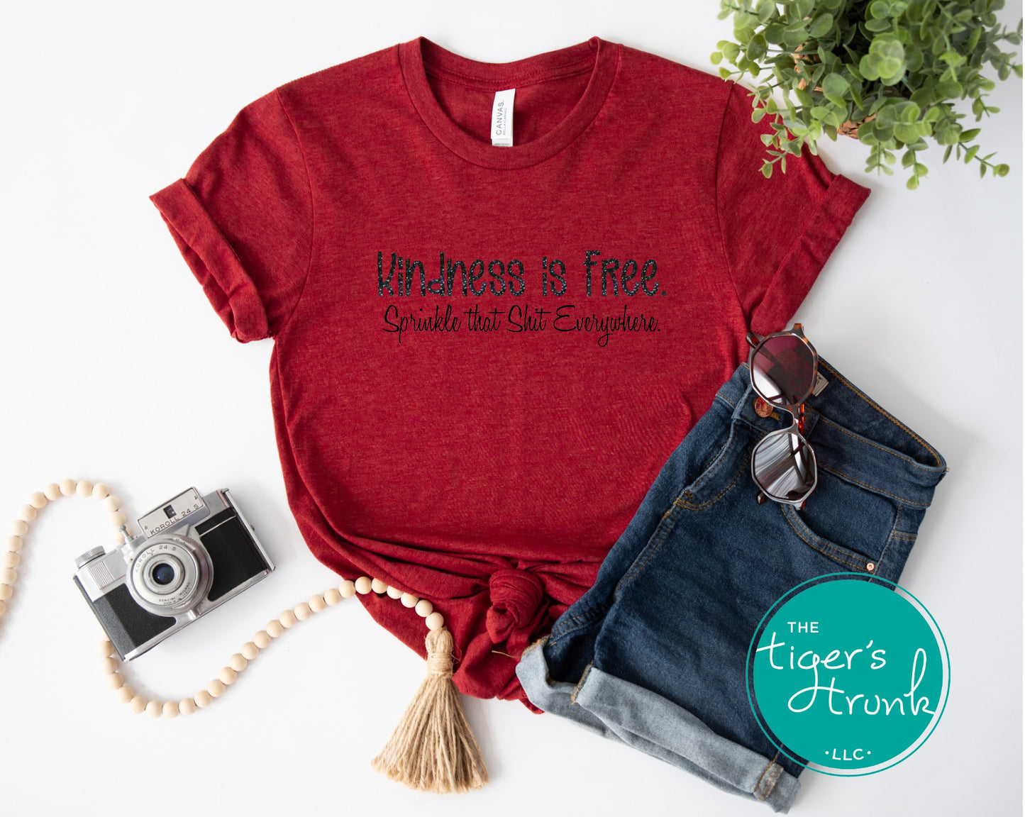 Funny and empowering Kindness Is Free t-shirt with “Sprinkle That Shit Everywhere” quote. A comfy tee perfect for spreading good vibes and sass.