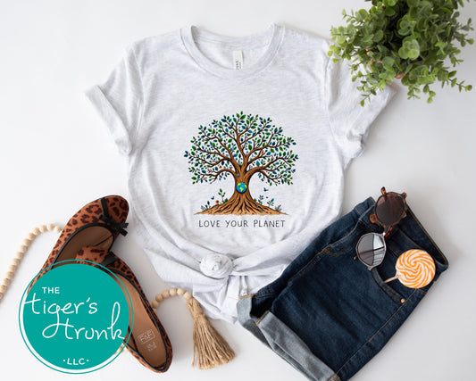 T-shirt with "Love Your Planet" message and tree with Earth design, perfect for eco-conscious wear, nature lovers, and Earth Day events