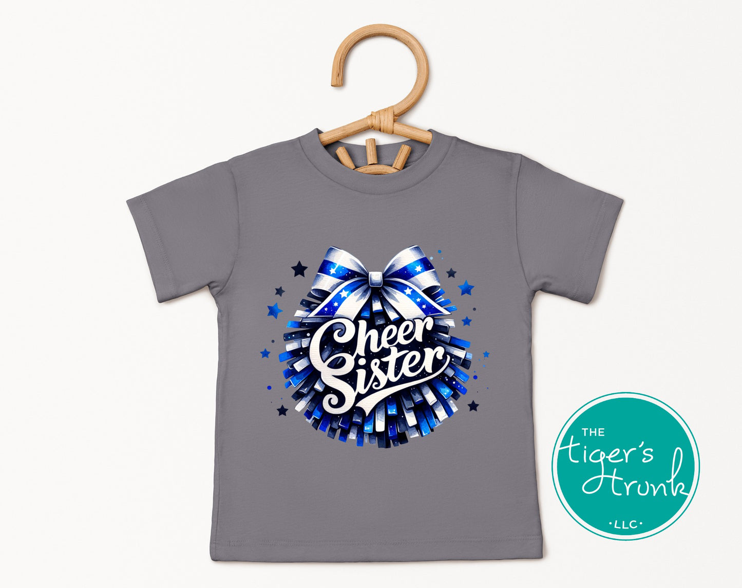 Gray t-shirt with 'Cheer Sister' design on a hanger, featuring the brand 'The Tiger's Throan'.