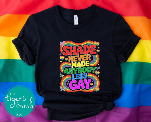 T-shirt with rainbow design and text that says “Shade Never Made Anybody Less Gay,” LGBTQ+ Pride graphic shirt for queer visibility and humor