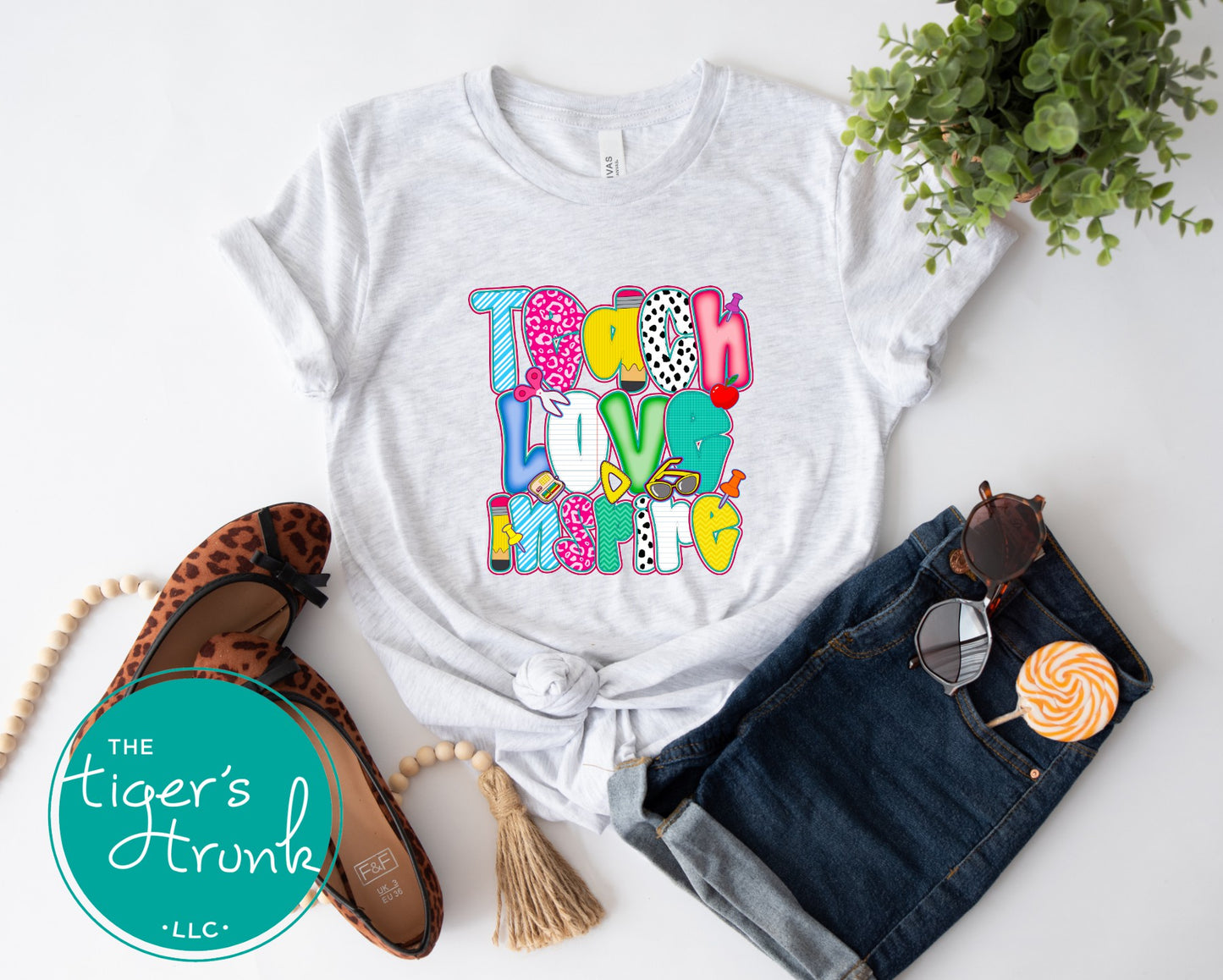 T-shirt with "Teach Love Inspire" message, inspirational and positive graphic tee for teachers and school staff