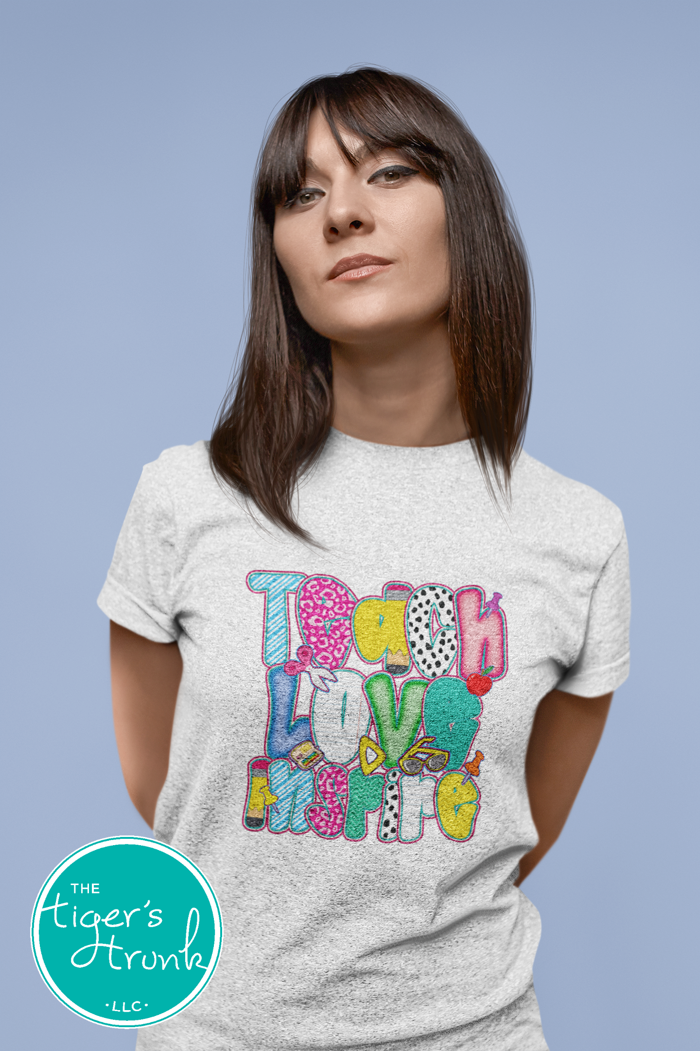 T-shirt with "Teach Love Inspire" message, inspirational and positive graphic tee for teachers and school staff